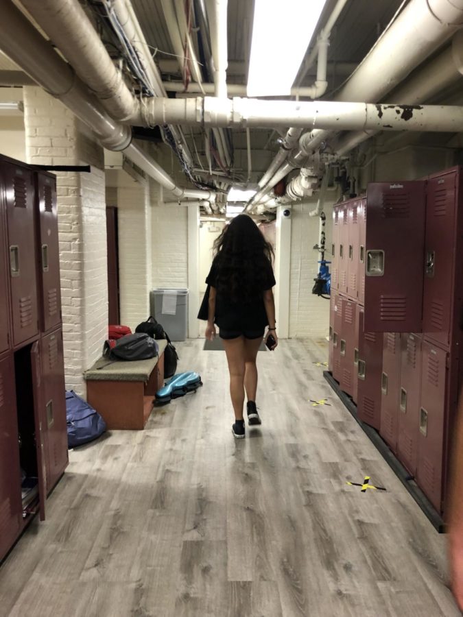 Alessia is walking down the freshman hallway to get to her next class.