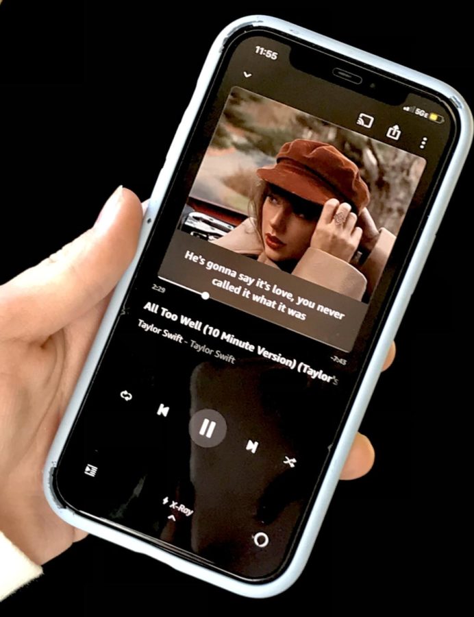 A student listens to the 10 minute version of Swift’s classic song “All Too Well”, released on Red (Taylor’s Version). This is one of the many new features that has gotten fans so excited for the re-recordings of Swift's older albums. 