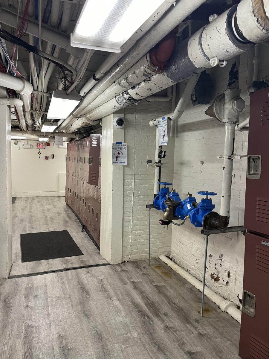 The Freshman hallway features many exposed pipes and electric wiring. The blue pipe on the right had issues regarding leaking earlier in the year causing freshman to have to relocate to convival spaces like the library. Further down the hallway there are lockers where students keep their books and other items during the day.