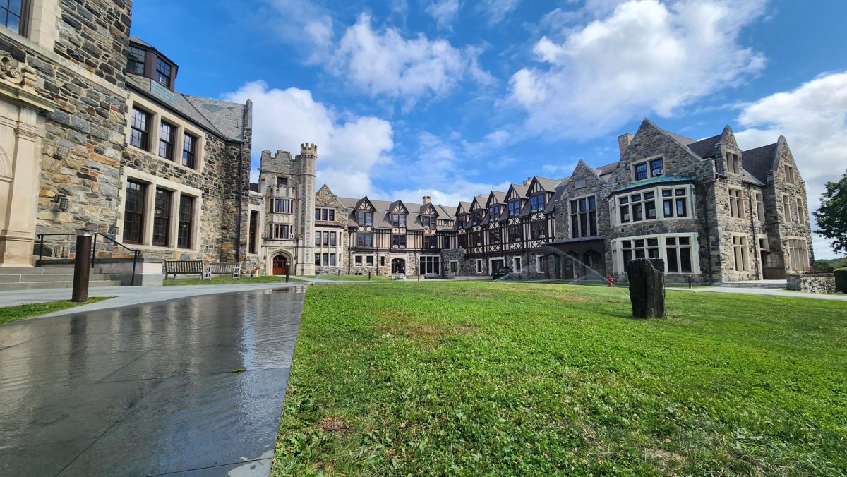 Landscape photo of Upper school Hackley campus. Groundskeepers keep the grass green by using sprinklers. 
