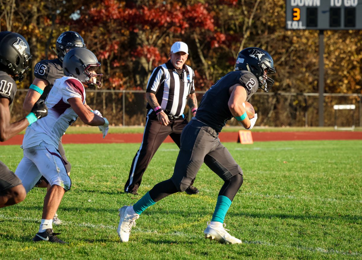 Jonah Hootnick makes a run from the 50 after snatching the ball from Riverdale.