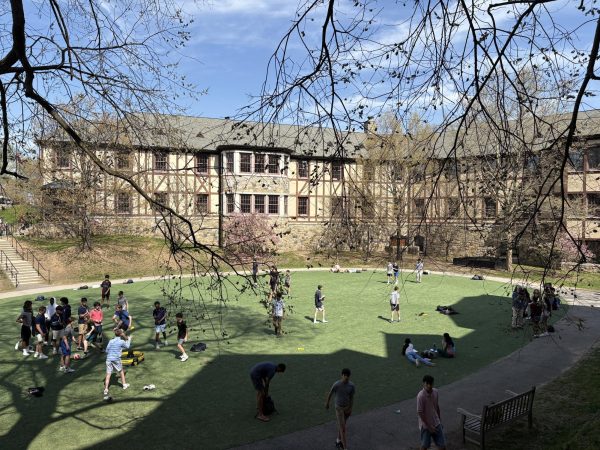 This photo shows the popularity of Akin Common for the student body during with many students either playing sports or relaxing on the turf fields.